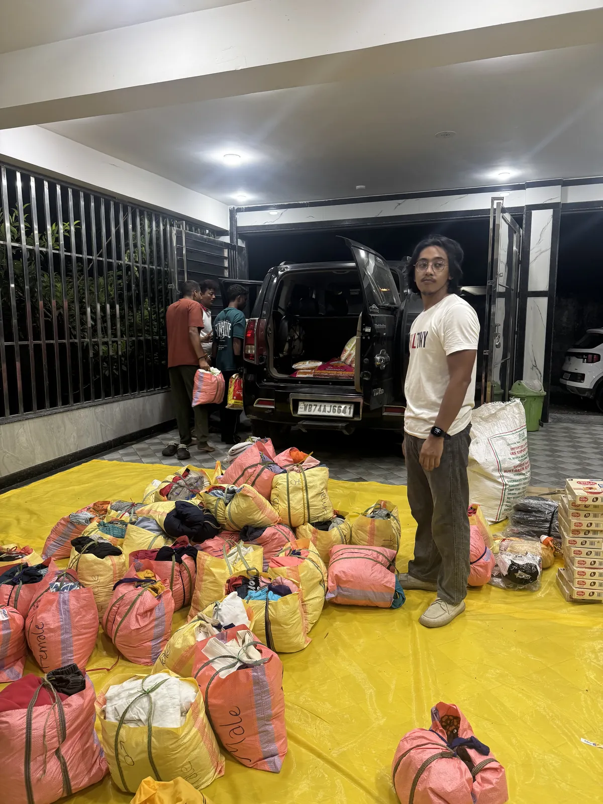 Siliguri, September 2026: a volunteer packing relief kits for the Bihar trip