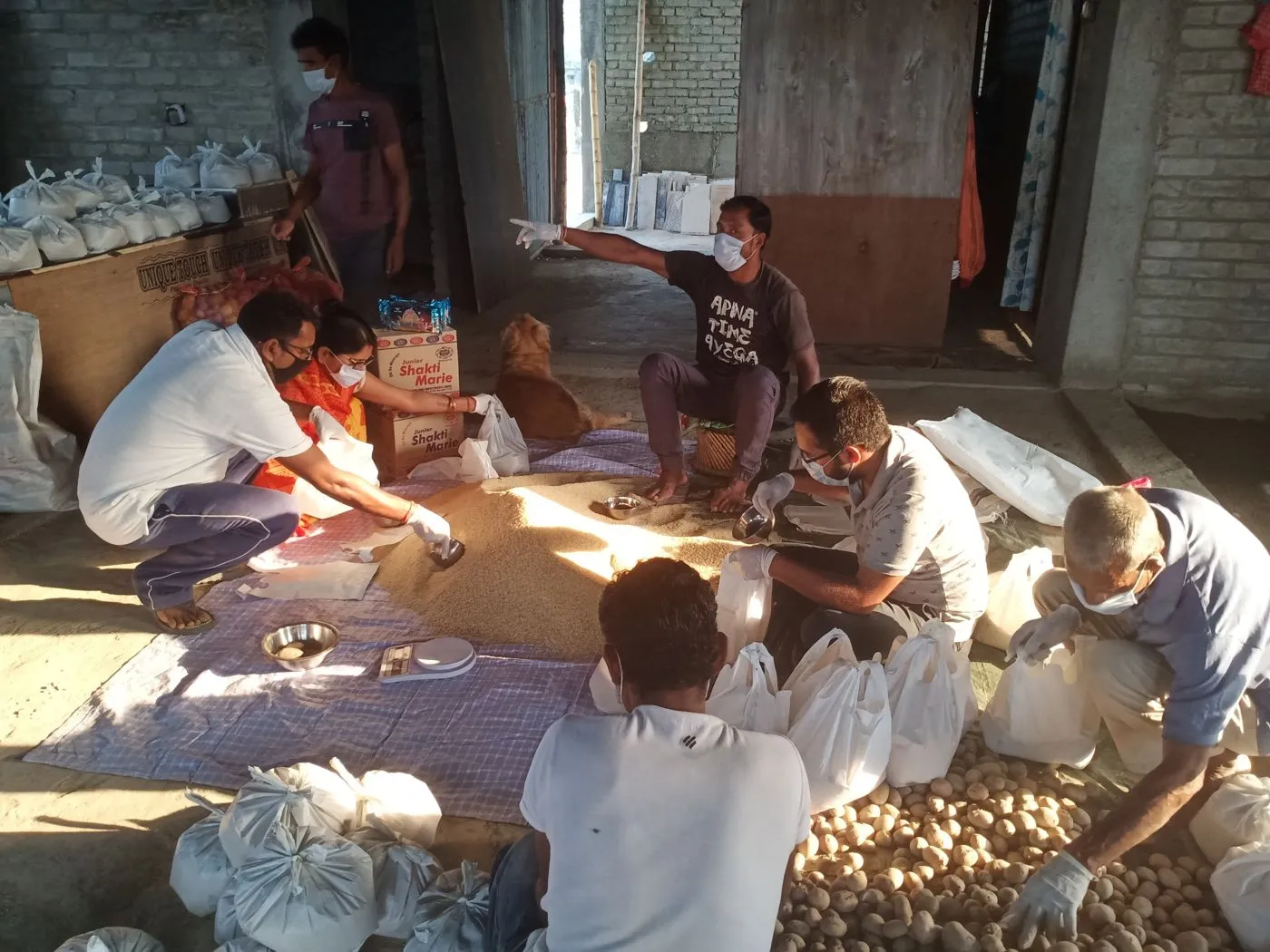 Sorting and bagging supplies for lockdown food distribution