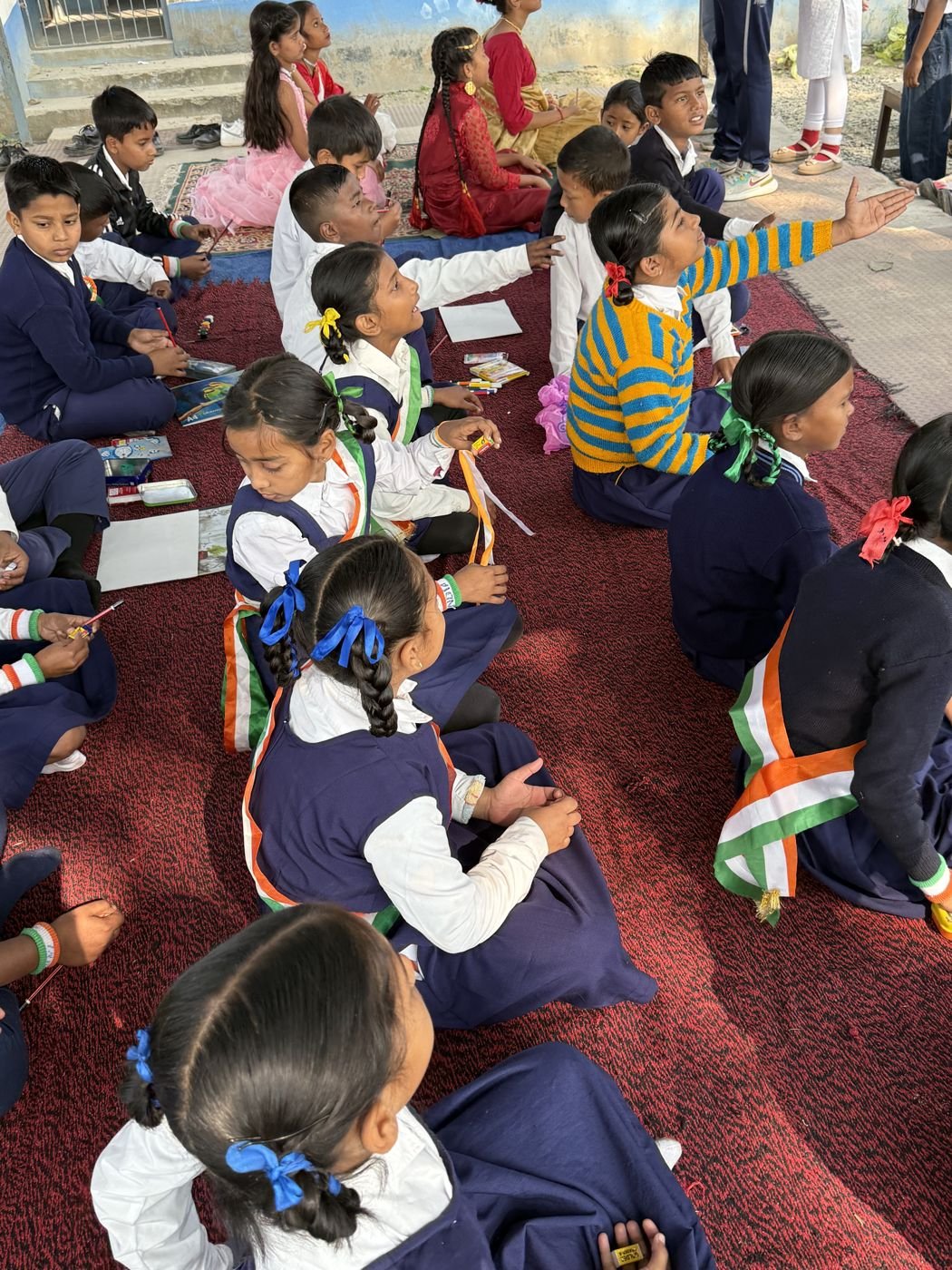 Children working on their drawings at a school competition