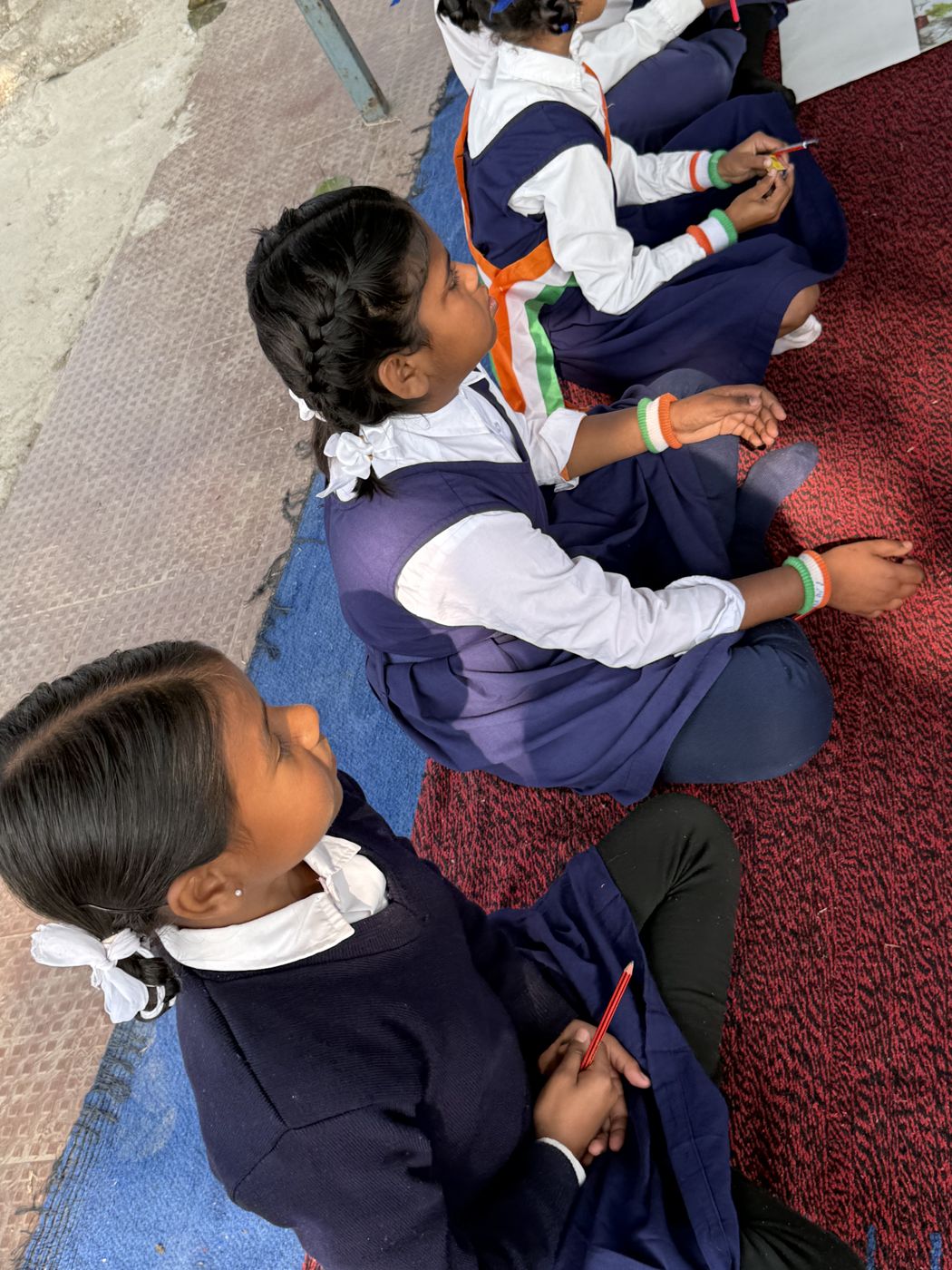 Children practising writing together — the kind of everyday learning moment the opportunity gap starts with