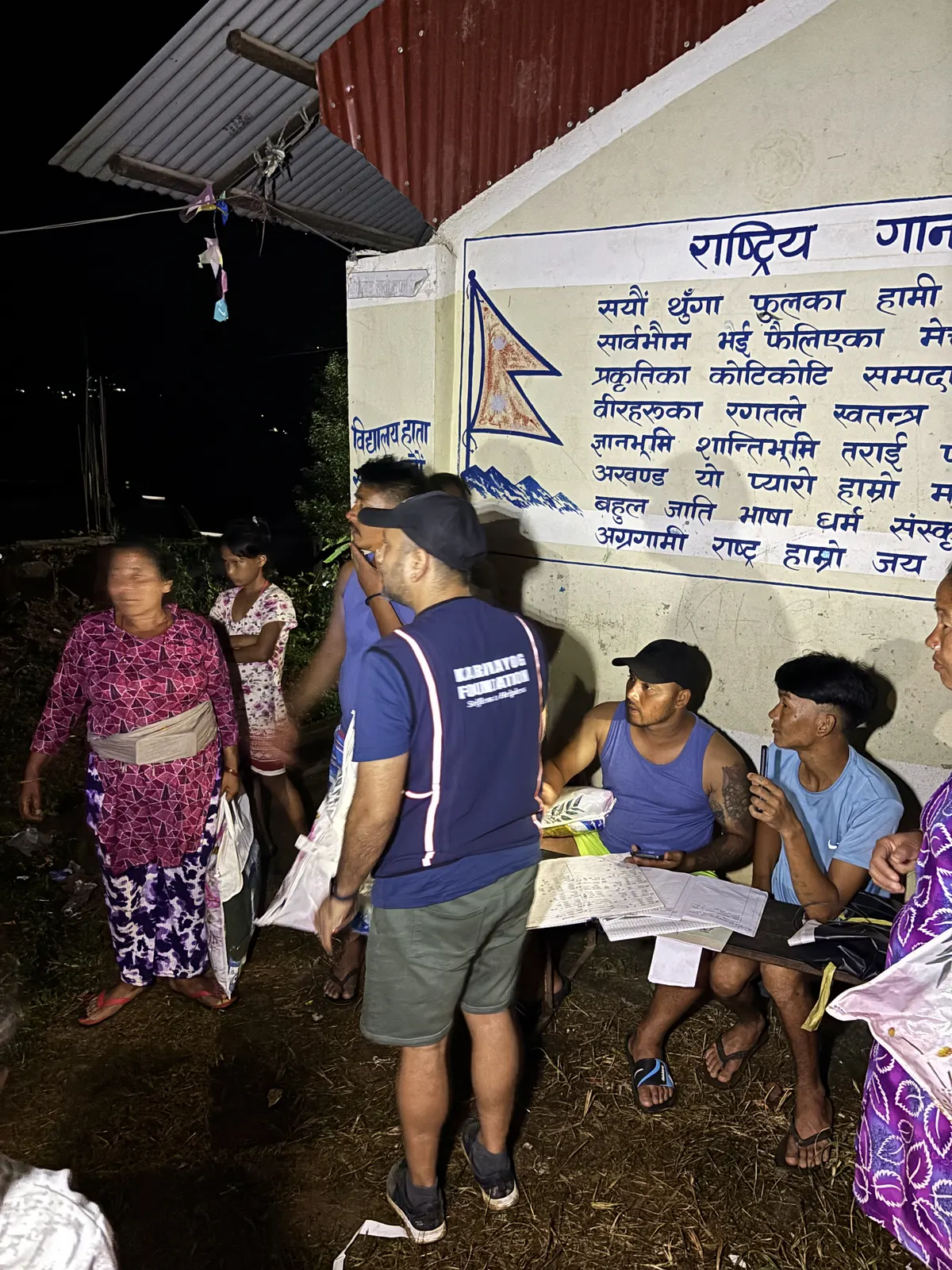 Nepal, September 2026: an evening distribution at a holding camp